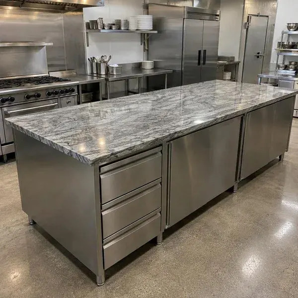 Stainless and stone prep counter in a Baltimore restaurant kitchen, installed before opening day