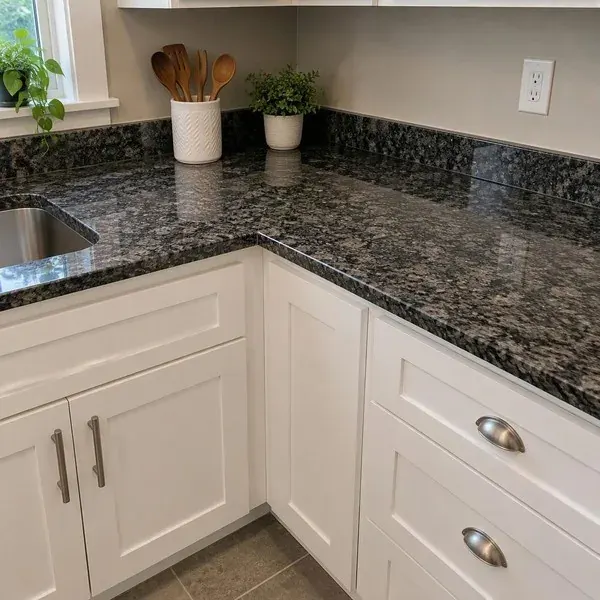 Dark gray granite countertop on white shaker cabinets, a classic granite countertop pairing for Baltimore kitchens