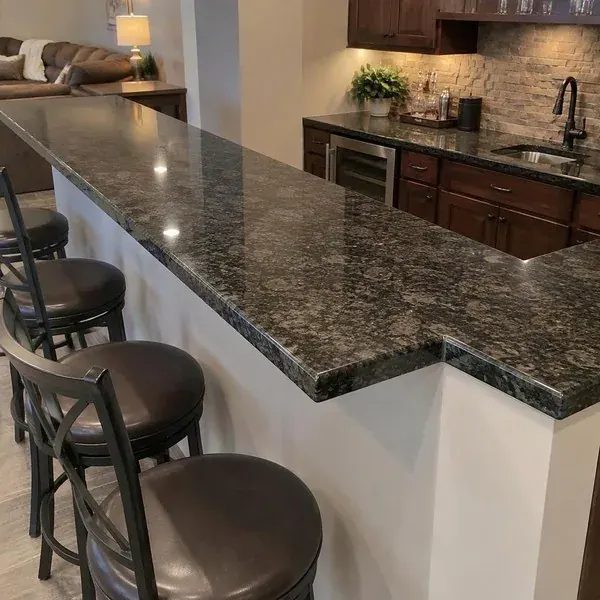 Fabricated stone bar top with notched corner Fabricated stone bar top with a notched corner built from a designer's drawings