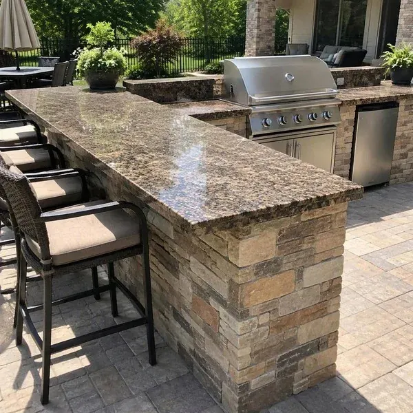 Granite outdoor bar countertop Granite outdoor bar countertop beside a built-in grill cutout on a Baltimore patio