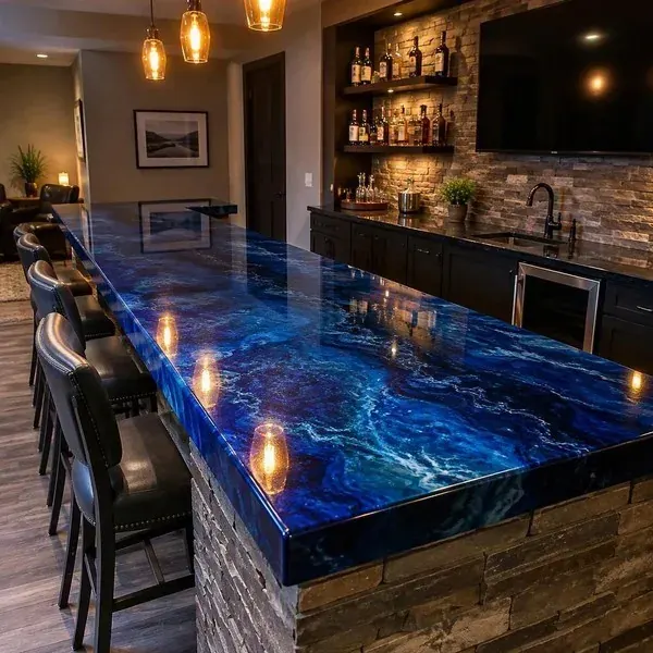 High-gloss blue and white epoxy bar top with a deep poured finish in a home bar