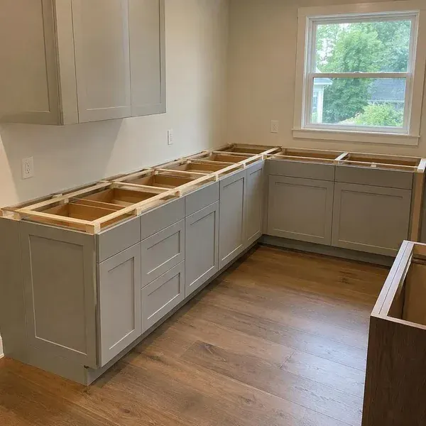 Countertop templating on base cabinets Countertop templating frame resting on empty base cabinets during measurement for a Baltimore kitchen