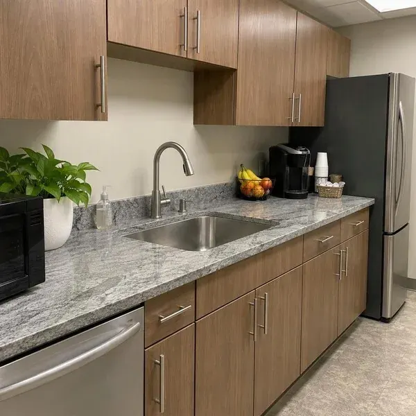Office breakroom countertop with a stainless sink, built for a commercial tenant fit-out
