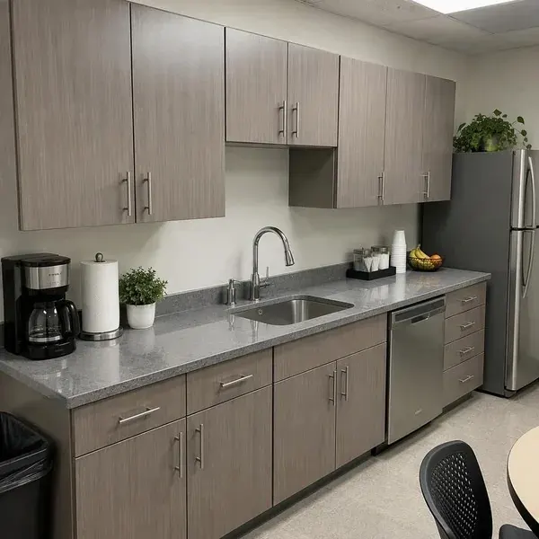 Quartz breakroom countertop below upper cabinets in a Baltimore office