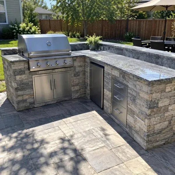 Patio outdoor kitchen countertop on a sunny day, the type of exterior project that needs village approval in Columbia