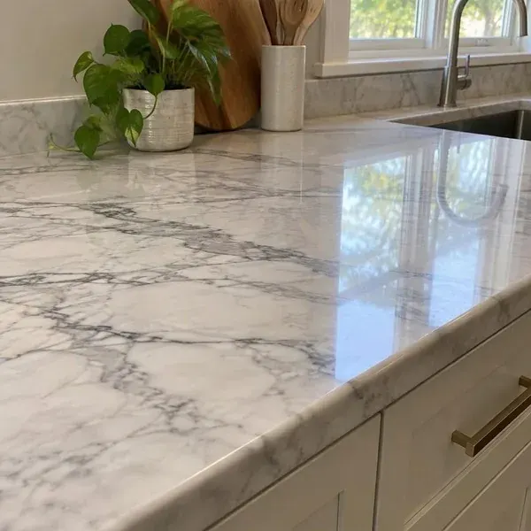 Close-up of polished marble countertop veining showing the depth and movement of natural marble