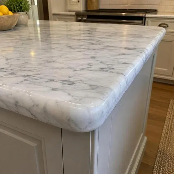 Repaired bullnose countertop edge Repaired full bullnose edge on a white marble island countertop corner