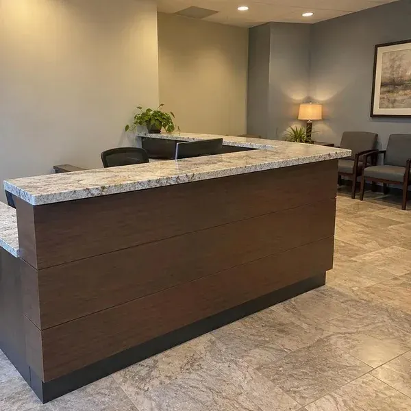 Stone-topped reception counter in an office lobby, a commercial countertop installation in Baltimore