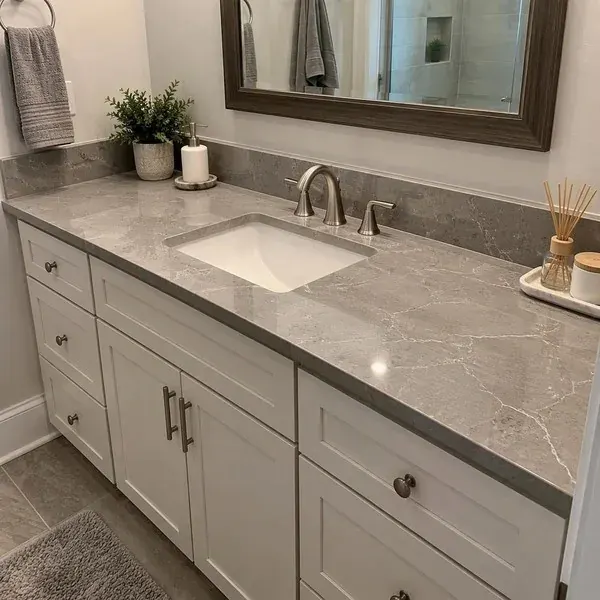 Vanity countertop installation Bathroom vanity countertop with a four-inch stone backsplash, one of our installation services