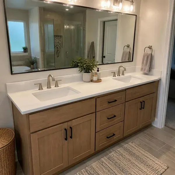 White quartz double vanity top with two undermount sinks in a Baltimore bathroom remodel
